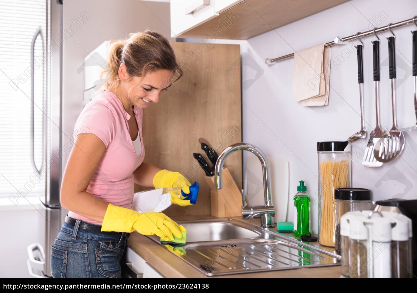 woman at kitchen sink vintate