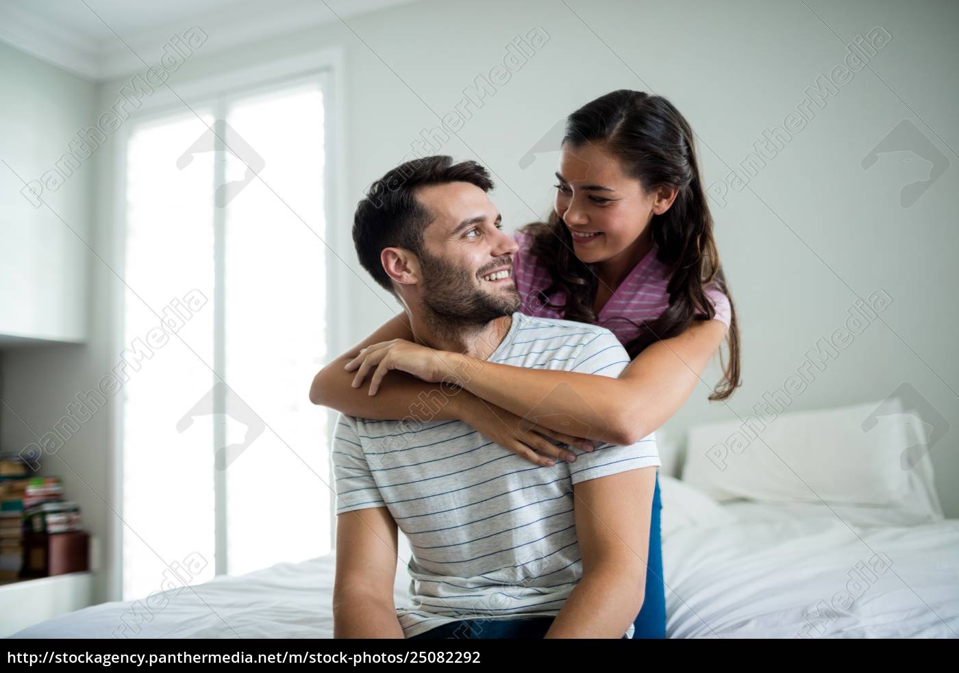 Royalty Free Photo 25082292 Couple Embracing Each Other In Bedroom