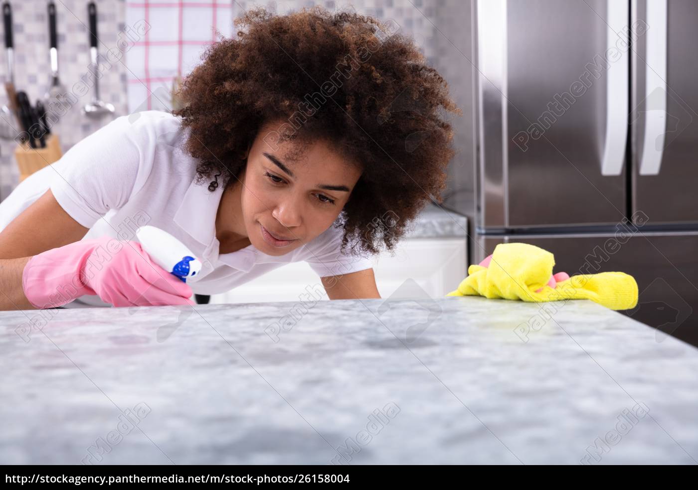 African Woman Cleaning Kitchen Counter - Royalty free photo - #26158004 ...