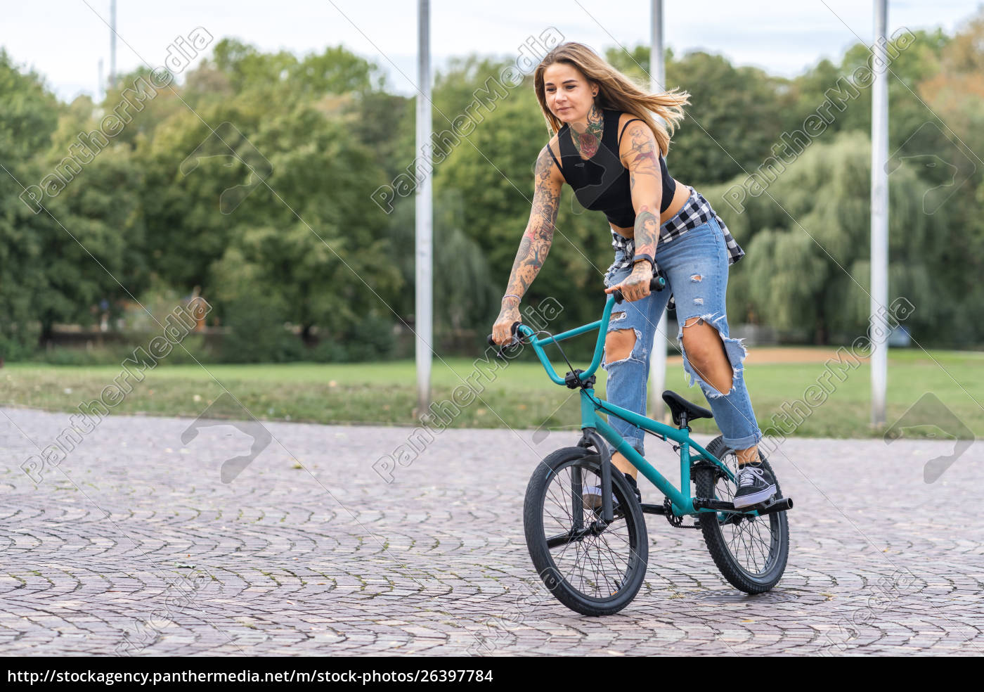 Young woman riding her BMX bike - Royalty free photo - #26397784 ...