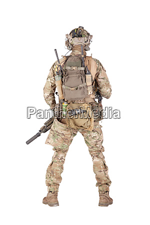 Armed army soldier standing backwards studio shoot - Stock image ...