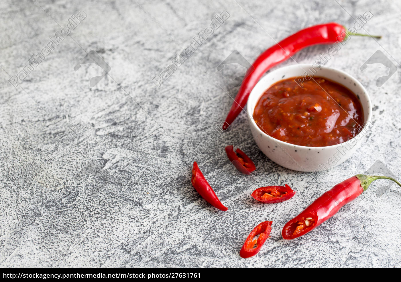 ketchup with hot chili pepper and garlic on a gray - Royalty free image ...